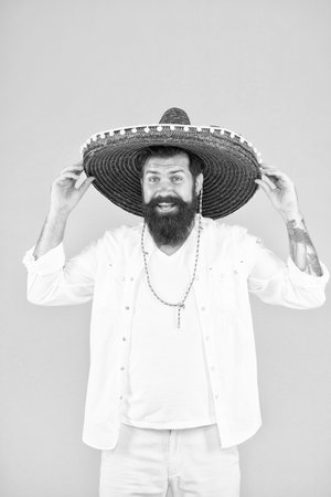 Ancestry language and cultural traditions. Discover ethnic and geographic origins. Bearded man in mexican hat. Mexican man wearing sombrero. Guy in wide brim hat. Ethnic concept. Ethnic backgroundの写真素材