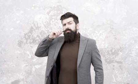 Casual style. Bearded hipster autumn style clothes. Guy in fall coat. Sewing studio services. Clothing alterations, custom creations. Trendy man with beard. Male fashion. Mature man businessmanの写真素材