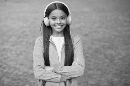 my happy life. listen to music. back to school. online private education. smiling kid study audio book. elearning and ebook. childhood happiness. teen girl in earphones. happy child wear headphonesの写真素材