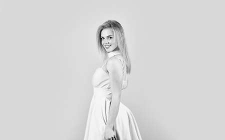 Best outfit ever. smiling lady with blonde hair. pretty girl looking stylish. fashion and beauty. hairdresser salon for every girl. female beauty. tender makeup concept. beautiful woman in sexy dressの写真素材