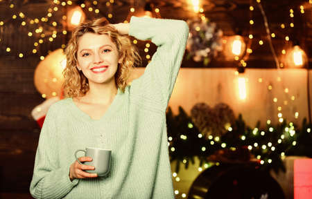 sweater weather. Time to celebrate. xmas mood. Woman drink cocoa. winter holidays. morning coffee. girl hold milk cup. happy new year. Christmas. Cheerful woman feel cosy.の写真素材
