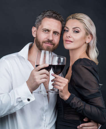sexy couple in love of woman and man with wine glass embrace and celebrate spacial occasion, dateの写真素材