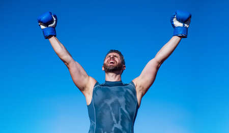 happy man boxer in boxing gloves celebrate success, sport