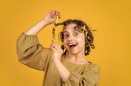 Enjoying shiny curls. Balm oil conditioner for styling. Hairdresser supplies. Fashion and beauty....