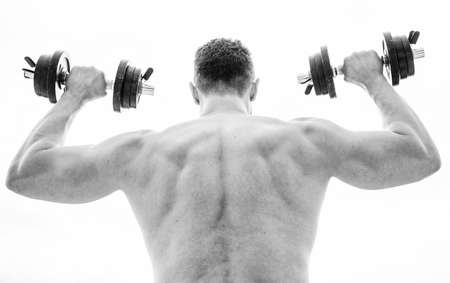 Strength and motivation. man sportsman weightlifting. steroids. athletic body. Dumbbell gym. Muscular back man exercising in morning with barbell. Healthy lifestyle. fitness and sport equipmentの写真素材