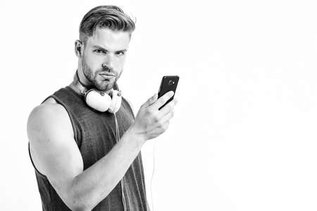 Listen music for motivation and inspiration. Audio quality. Modern earphones. Music application smartphone. Inspiring music concept. Man handsome unshaven hipster listen music using headphones gadgetの写真素材