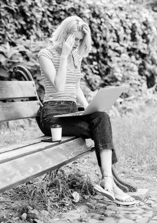Girl work with laptop in park. Natural environment office. Education concept. Notebook internet remote job. Work in park. Reasons why you should take your work outside. Power of nature callsの写真素材