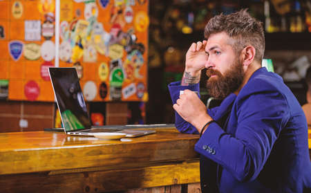 Surfing internet. Man bearded businessman sit pub with laptop and cup of coffee. Manager work online...
