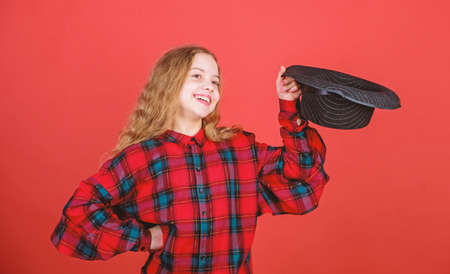 Acting lessons guide children through wide variety of genres. Develop talent into career. Girl artistic kid practicing acting skills with black hat. Enter acting academy. Acting school for childrenの写真素材