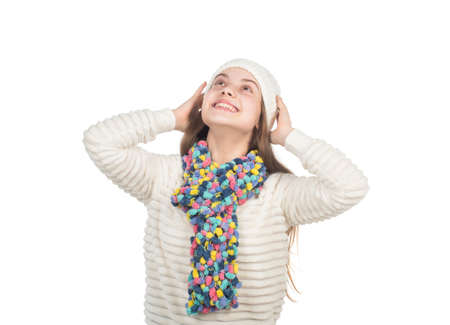 happy teen girl in knitted hat and scarf warm clothes isolated on white, casual knitの写真素材
