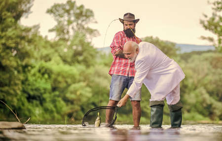 hobby and recreation. Success. Fishermen. successful catch. retired businessman. male friendship....
