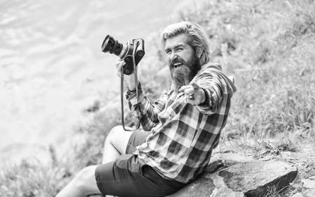 Best way to relax. paparazzi use digital camera. Photo shoot session. Handheld shooting. man photographer do shooting session. Shooting day hobby. Hobby and leisure. mature skilled camera manの写真素材