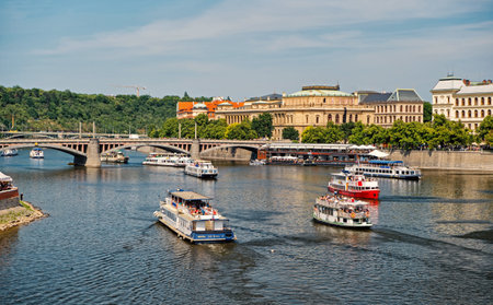 Prague, Czech Republic - June 03, 2017: pleasure boats on Vltava river. Holiday cruiser ships on...