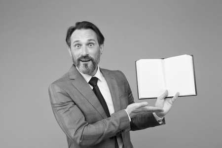 Spreading knowledge. happy man found what he was looking for. businessman is amazed to see inside of...