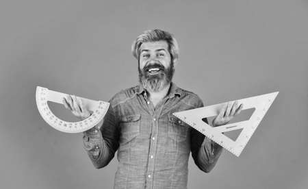 man use ruler. math or mathematics. Stem education concept. study algebra at university. back to school. teacher of arithmetic. calculation and search of various data. protractor and triangeの写真素材