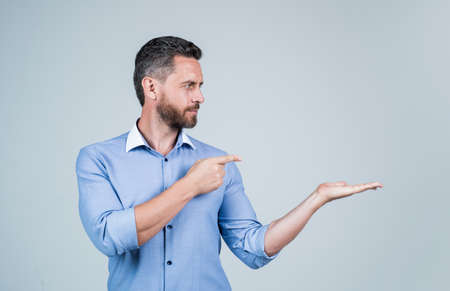 confident business boss or lawyer pointing finger on copy space, advertisingの写真素材