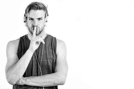 Audio quality. Modern earphones. Online music services. Inspiring music concept. Man handsome unshaven hipster listening music using headphones gadget. Listen music for motivation and inspirationの写真素材