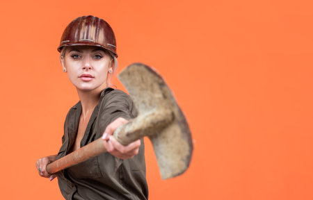 working woman. female builder hold shovel. building and construction. lady architect worker.