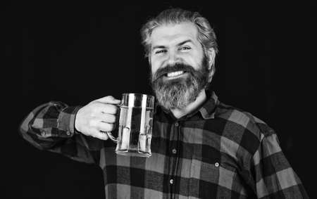 Everything you always wanted in beer. Brutal bearded man drink beer. Beer pub. Bartender bar. Man hold mug of beer. Hipster at bar counter. Having fun. Alcohol beverage. Modern hipster getting drunkの写真素材