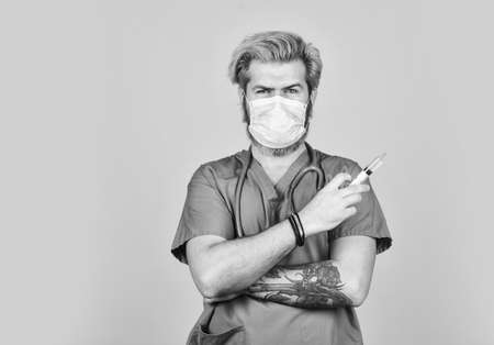 flu or influenza. Immunity and health care. virus infection test. hpv vaccine. copy space. coronavirus epidemic from china. mature doctor use syringe in respirator mask. skilled nurse make injectionの写真素材