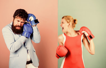 Complicated relationships. Couple romantic relationships. Man and woman boxing fight. Boxers fighting gloves. Difficult relationships. Couple in love competing boxing. Conflict concept. Family lifeの写真素材