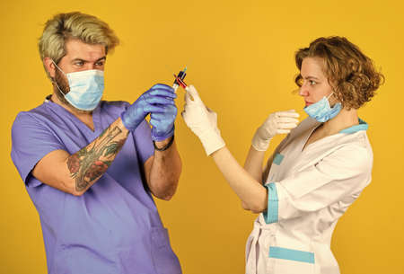 injection in hospital. virus infection injection vaccine. doctors wear respirator mask. for treating...