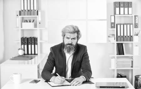 writing on paper. business analyst. business process specialist with folder. businessman hold office documents. skilled consultant or trainer. man deal with problem. auditor check financial reportの写真素材