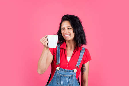 female drinking tea from cup. cheerful woman drink coffee. girl with brunette hair in morning....