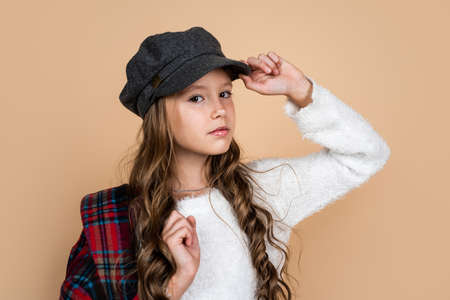 love her style. beauty and fashion. cheerful parisian child has long hairstyle. stylish kidの写真素材