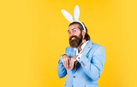 Ready to celebrate. Easter Holiday Greeting. celebrating easter in springtime. funny man in rabbit costume. happy easter. man imagine he is rabbit. male wear bunny ears. just having funの写真素材