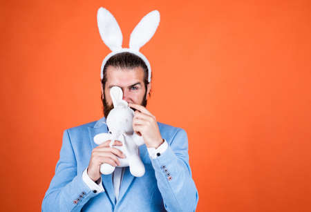 just having fun. Easter Holiday Greeting. celebrating easter in springtime. funny man in rabbit costume. happy easter. man imagine he is rabbit. male wear bunny ears. bunny hunt beginsの写真素材