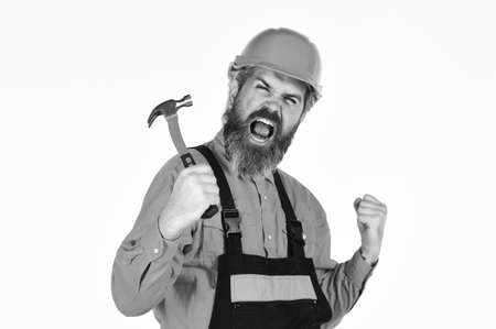 Technical work. Impulse for changes. Bearded mature man in uniform. Guy with hammer. Good hammer. Essential tips for using hammer correctly. Requirements for projects. Professional master repair roofの写真素材