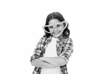 I like you. Kid happy lovely feels sympathy. Kid girl heart shaped eyeglasses confident. Girl curly hairstyle adorable smiling face. Child charming smile isolated white background. First loveの写真素材