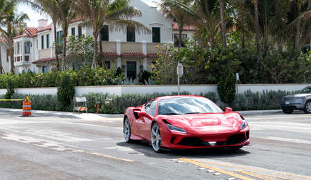 Palm Beach, Florida USA - March 21, 2021: red Ferrari SF90 Stradale luxury car on road