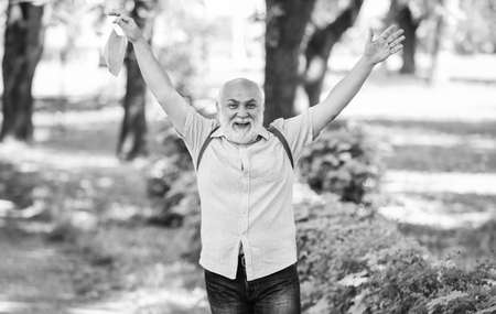 Easing of lockdown restrictions. Take off mask. Mask protecting from virus.  Breathe freely. Pandemic concept. Limit risk infection spreading. Senior man face maskの写真素材