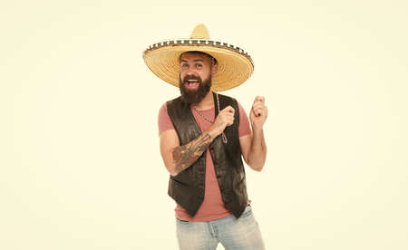 Mexican melody drives him. Man bearded cheerful guy wear sombrero mexican hat. Mexican party concept. Celebrate traditional mexican holiday. Guy happy cheerful festive outfit ready to celebrateの写真素材