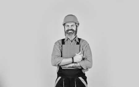 Inspecting. Control concept. Foreman with document. Delivering building materials. Man in hard hat holding clipboard looking information. Buy materials for renovation. Bearded storekeeper. Checklistの写真素材