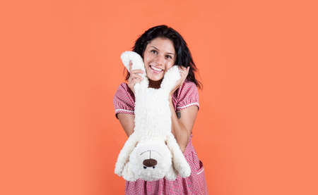 just having fun. feel happiness and joy. happy beautiful lady playing with toy. happy valentines day gift. female in good mood. cheerful woman hold teddy bear toy. girl with fluffy bearの写真素材