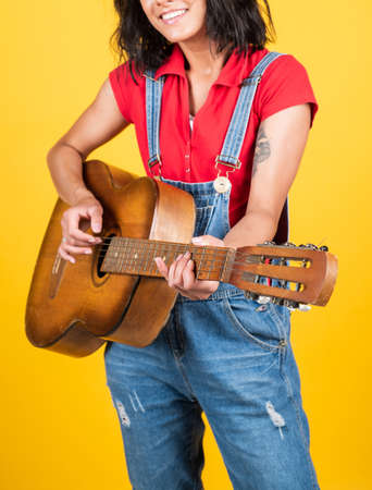 Find a melody. country music. music is my life. woman with acoustic instrument. have fun on party. guitar player or guitarist. happy singer with guitar. girl playing guitar. musical school conceptの写真素材