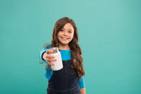 Vital habits. Little cute smiling child going to take vitamin. Food additives. Omega oils and acids. Best vitamins. Pills for kids. Vitamin and mineral complex. Medicine concept. Boost immunityの写真素材