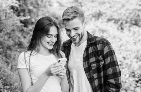 Surfing internet. Buy online. Internet dependence. Guy and girl nature smartphone. She always online. Man jealous girlfriend messaging online. Woman use mobile phone. Mobile addicted. Social networksの写真素材