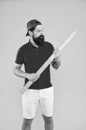 Measuring with ruler. Size measurement. Measuring length. Sizing clothes. Student study stem disciplines. Long ruler tool equipment. What about your size. Bearded man with big measuring instrumentの写真素材