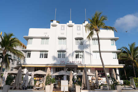 Miami, USA - April 15, 2021: sidewalk cafe at The Carlyle hotel on Ocean Drive in Florida