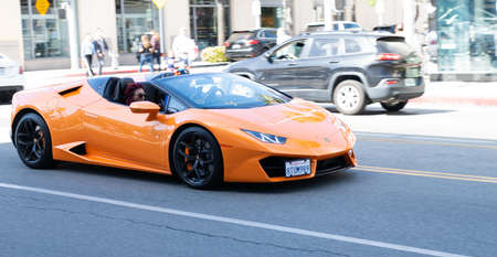 Los Angeles, California USA - April 11, 2021: orange Lamborghini Aventador on road in LA. side viewのeditorial素材