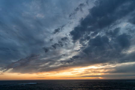 early morning sunrise over sea. ocean sunset on sea water with sunset sky. seascape sundown.