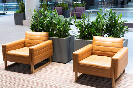 Modern armchairs furniture in shopping mall public seating area, lounge