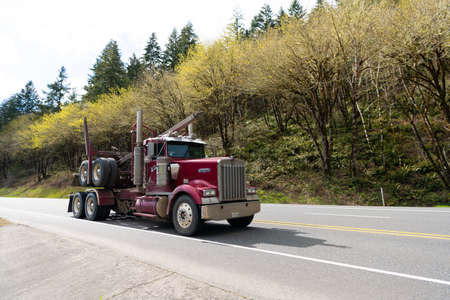 Oregon, USA - April 05, 2021: kenworth hauler truck semi trailer for transporting on highway road.のeditorial素材