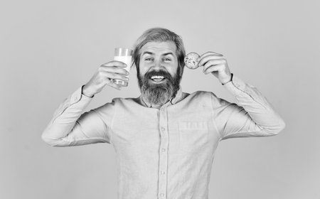 Delicious treats. Homemade is best. Recipe for baking cookies. Bearded man drink milk with cookies....