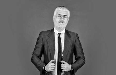 Fashion is his life. confident businessman wear glasses. mature man dyed beard and hair. grooming for formal meeting. male beauty and charisma. professional barber at barbershop. agile businessの写真素材