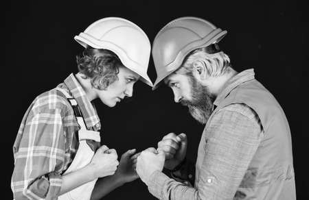 building concept. imagine their new house. Portrait of confident handyman and his female colleague. follow repairing steps. wear special uniform and use tools. Maintenance serviceの写真素材